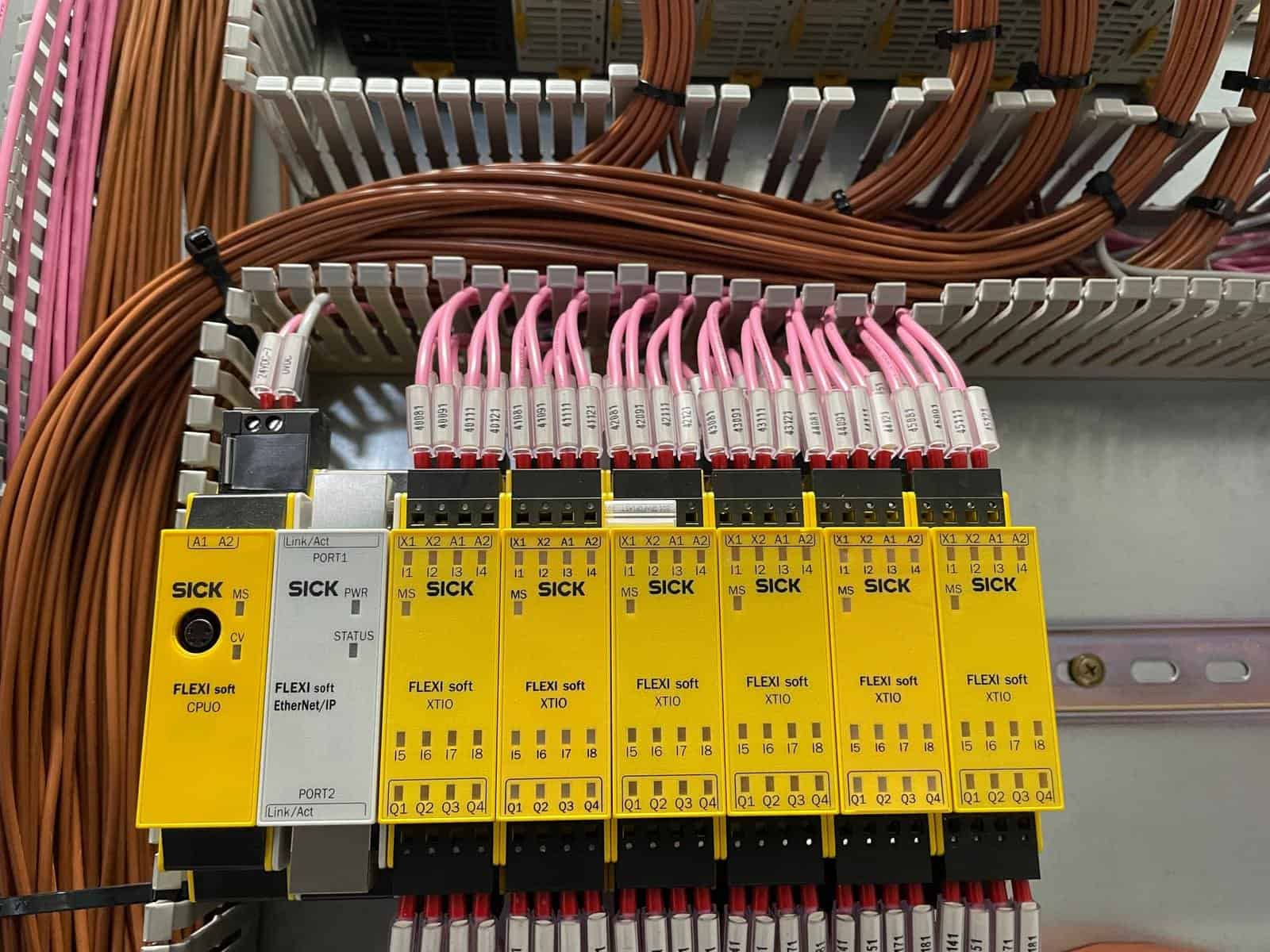 Safety-rated PLC and I/O modules inside a machine safety control panel